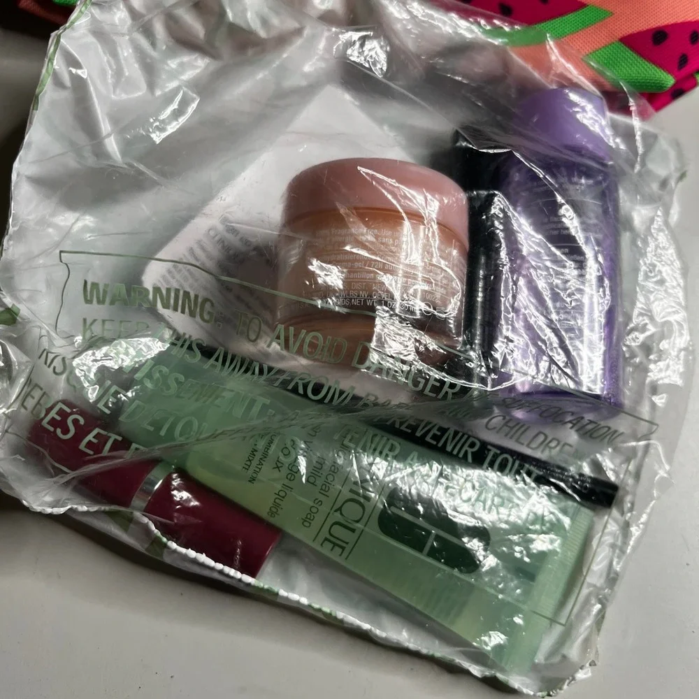 Clinique x Donald Robertson Watermelon Makeup Bag & 6pc Travel Skincare Gift Set